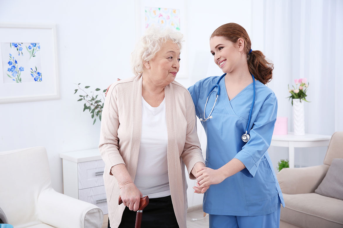 Physical therapist assisting a patient during rehabilitation